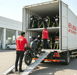 Bike being loaded into a secure transport truck