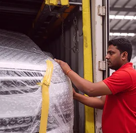 Driver guiding the vehicle into the truck's container