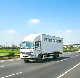 Transport truck with bulk cars, traveling across Indian highways for dealership deliveries