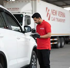 Secured vehicle with insurance coverage being loaded onto a carrier